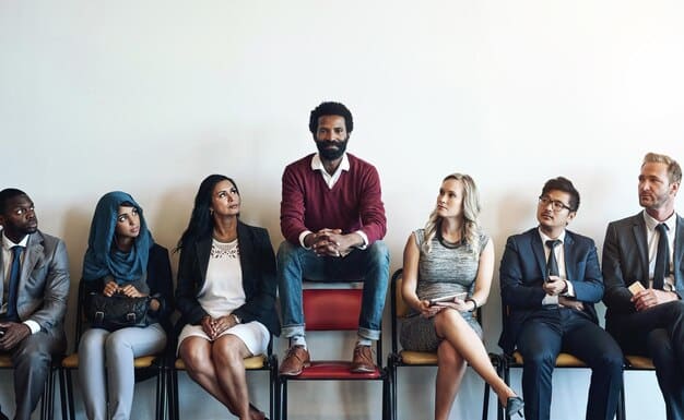 A diverse interview panel interviewing a candidate. The panel includes individuals of different genders and ethnicities, showcasing a commitment to diverse perspectives in the hiring process.