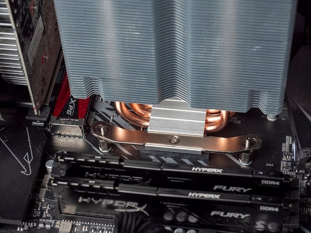 A close-up shot of a high-end graphics card (GPU) inside a gaming PC. The GPU features a complex array of cooling fins, heat pipes, and copper components. RGB lighting accents the card, highlighting its brand logo. The focus is on the intricate engineering and design of the GPU.