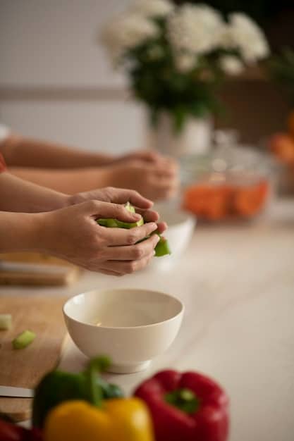 A close-up shot of a person's hands mindfully preparing a colorful, nutritious meal in a well-lit kitchen, emphasizing the importance of conscious food choices and preparation.