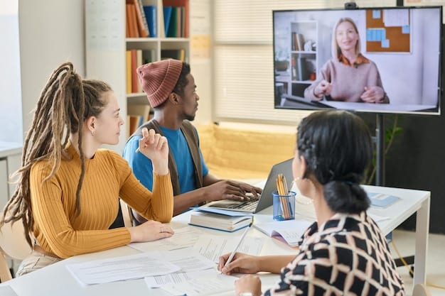 A diverse group of students participating in a virtual classroom session via video conference. They are engaged and interacting with the instructor on the screen.