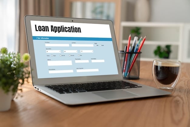 A laptop displaying a student loan forgiveness application form. The form is partially filled out, and a hand is hovering over the 