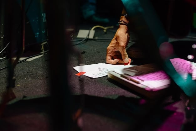 A close-up shot of a film critic writing notes in a notebook during a movie screening. The critic is wearing glasses and has a thoughtful expression. The focus is on the notebook and pen, suggesting meticulous analysis.