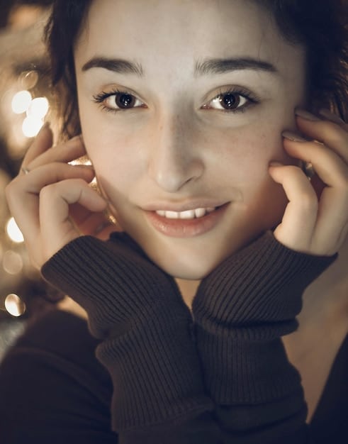 A close-up shot of Go Min Si, showcasing her expressive eyes and youthful features, with a soft, natural lighting that enhances her beauty.